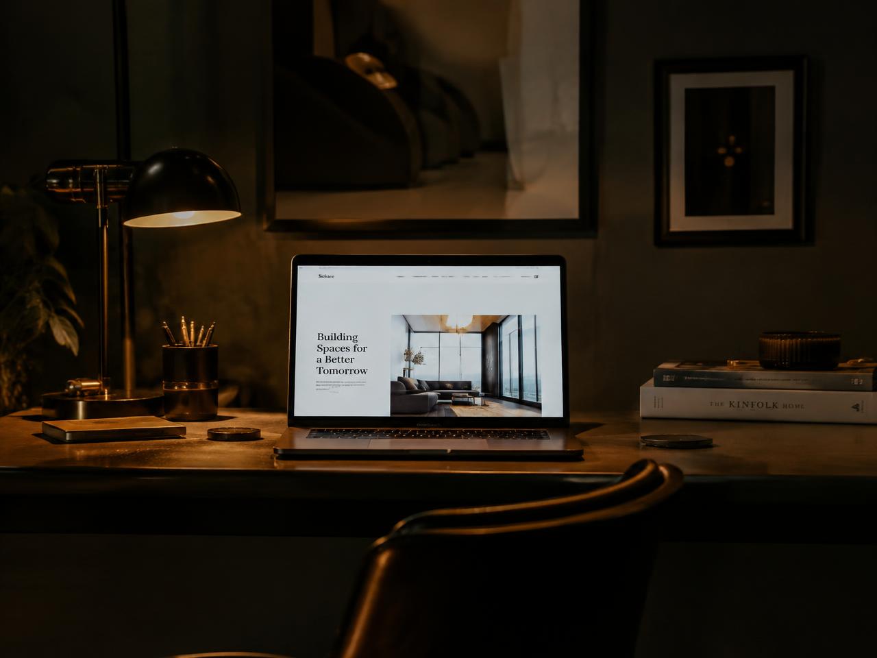 A laptop showing a clean modern website on a desk